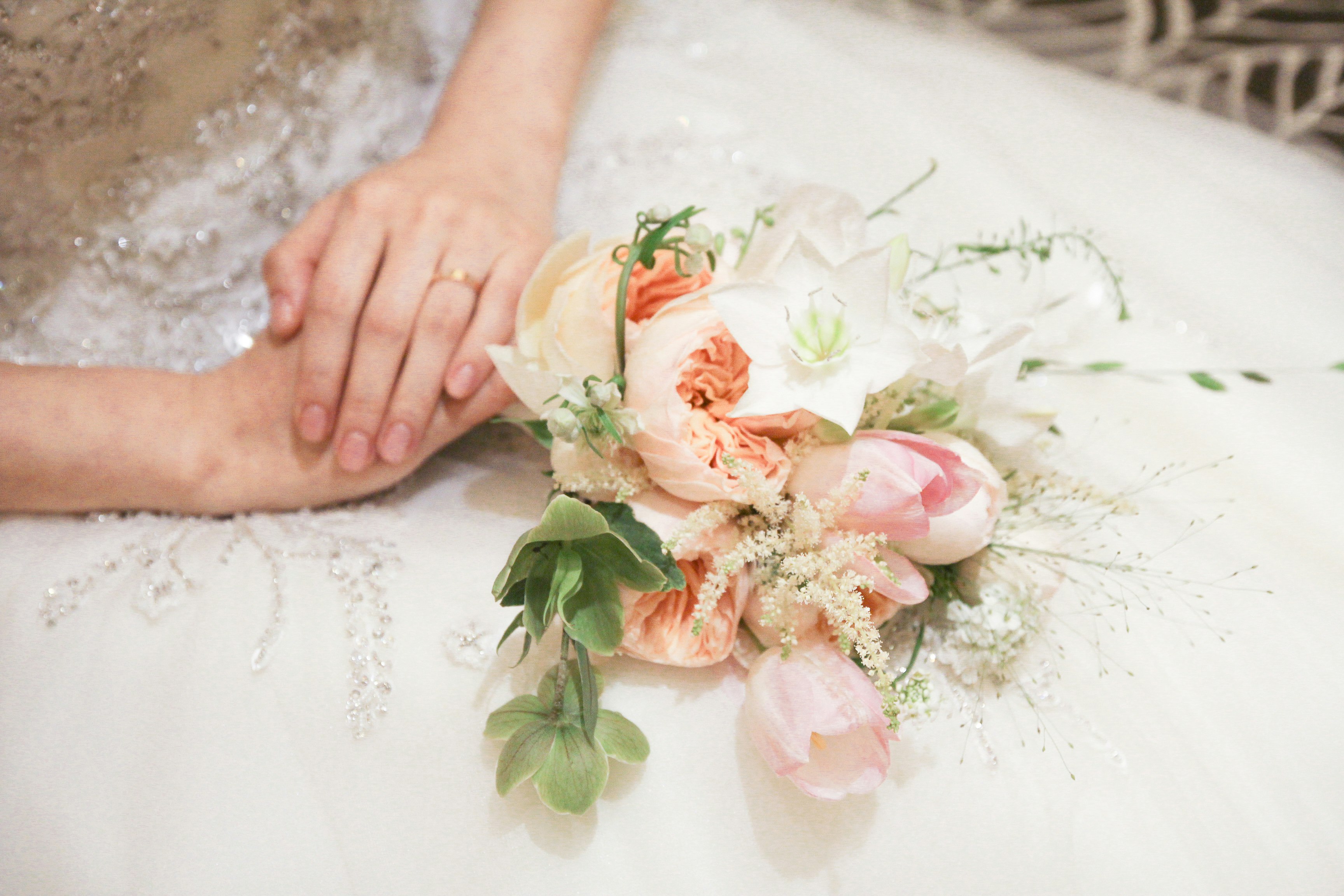 wedding bouquet on bride's lap